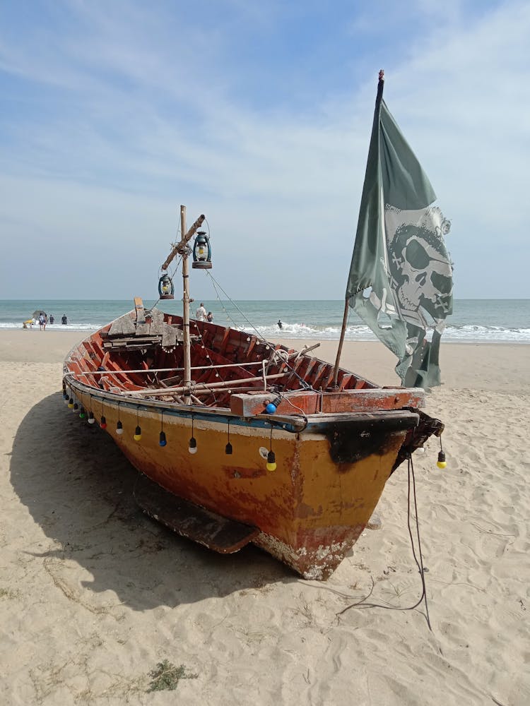 Old Pirate Ship On Sand Beach