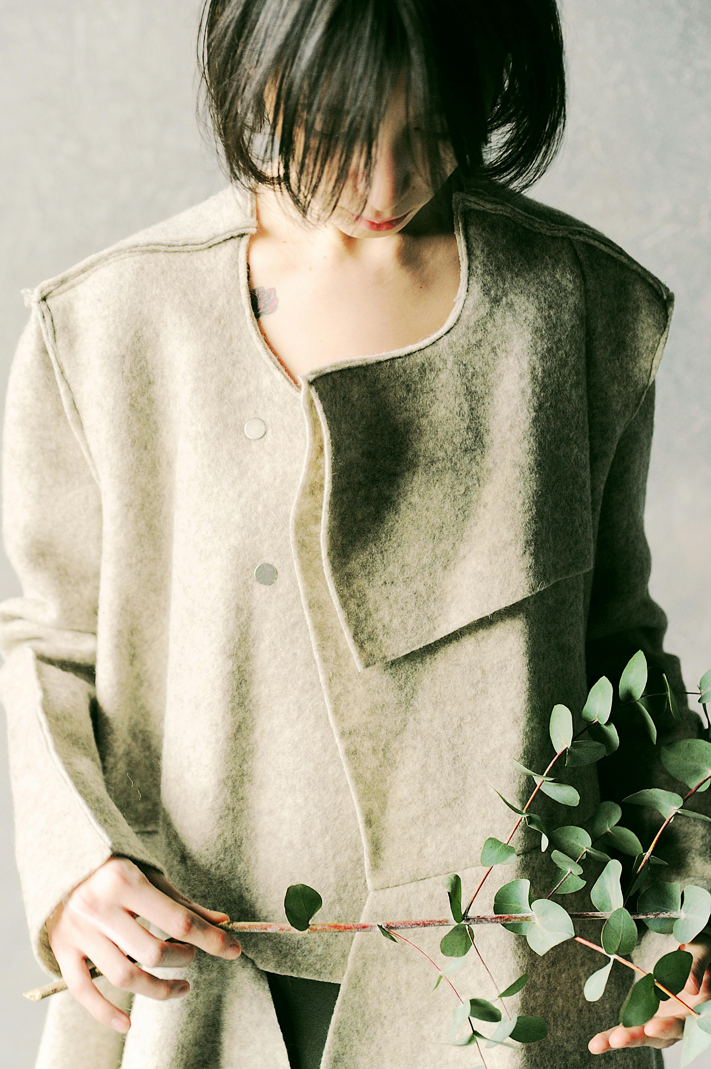 Woman Holding Dslr Camera Sitting on Red Leaved Plant Woman Holding Dslr Camera Sitting on Red Leaved Plant