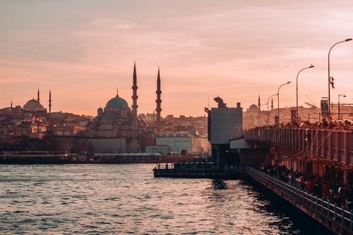 Free Scenic sunset over İstanbul's skyline with mosques and the Galata Bridge. Stock Photo