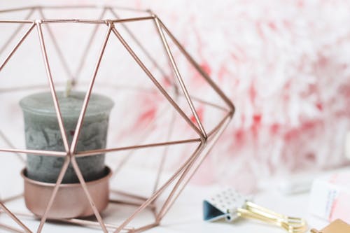 Selective Focus Photography Of Candle In Pink Ornate Holder