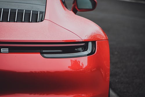 Red Car on Gray Asphalt Road