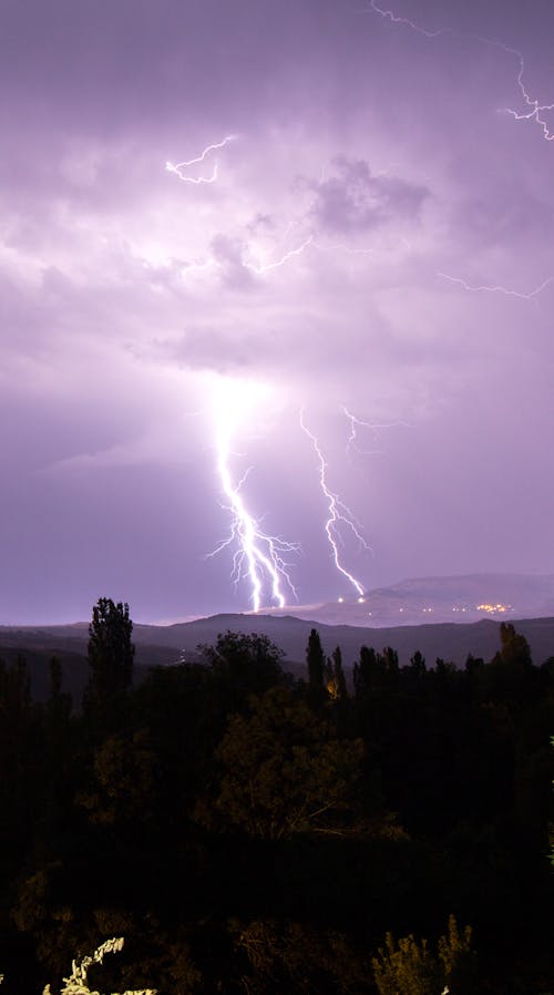 Lightning Strike on Mountain during Night Time