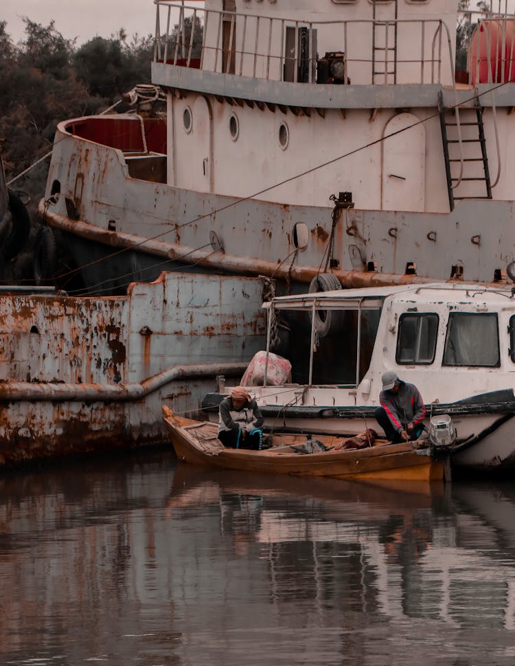 Fishermen On A Boat In Dock 