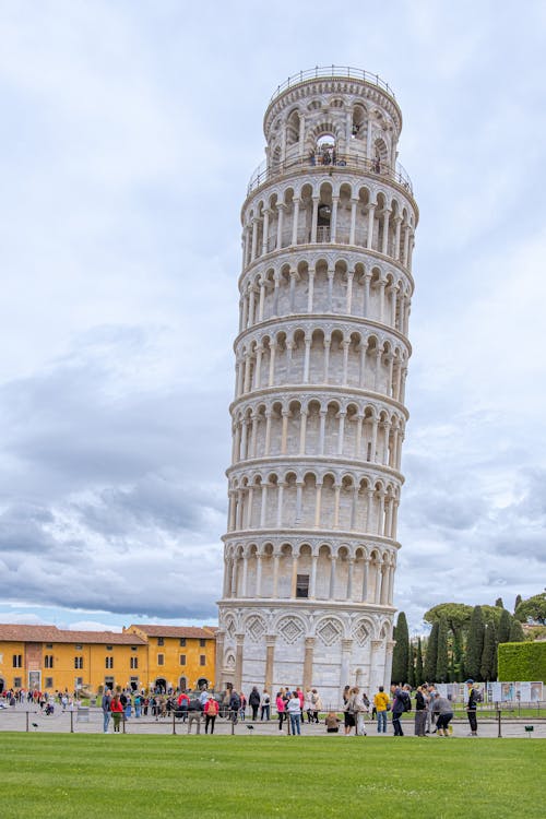 A Group of People Standing in Front of the Leaning Tower of Pisa