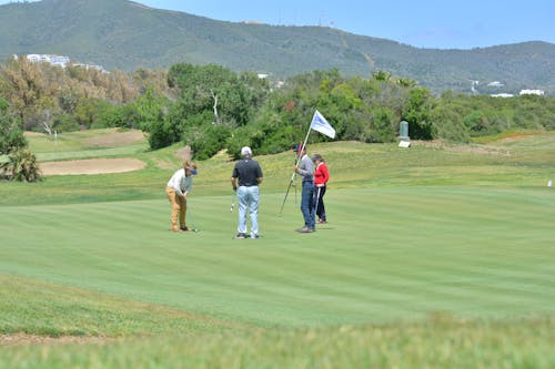 Free A Group of People Playing Golf Stock Photo