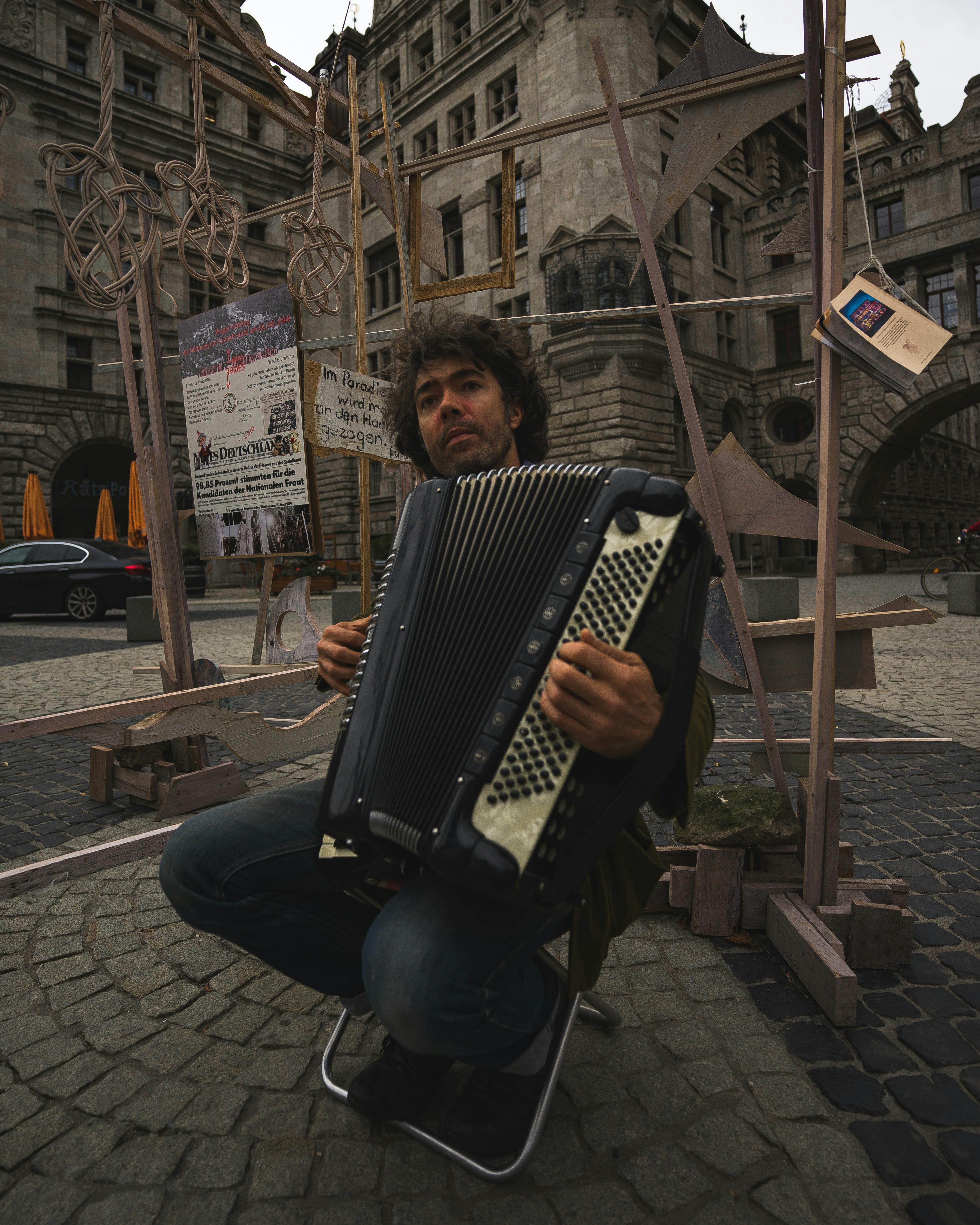 Man Playing Musical Instrument on the Street · Free Stock Photo