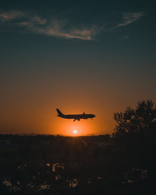 Silhouette of an Airplane in the Sky 