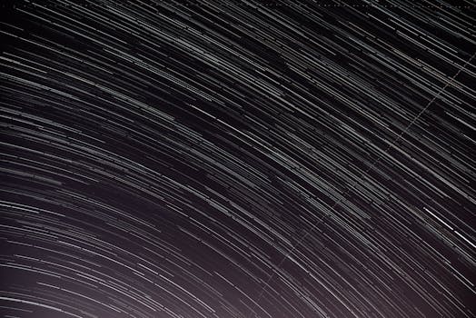 Captivating long-exposure star trails in a clear night sky, perfect for astrophotography lovers.