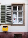 White Bear Plush Toy on Yellow Plastic Container