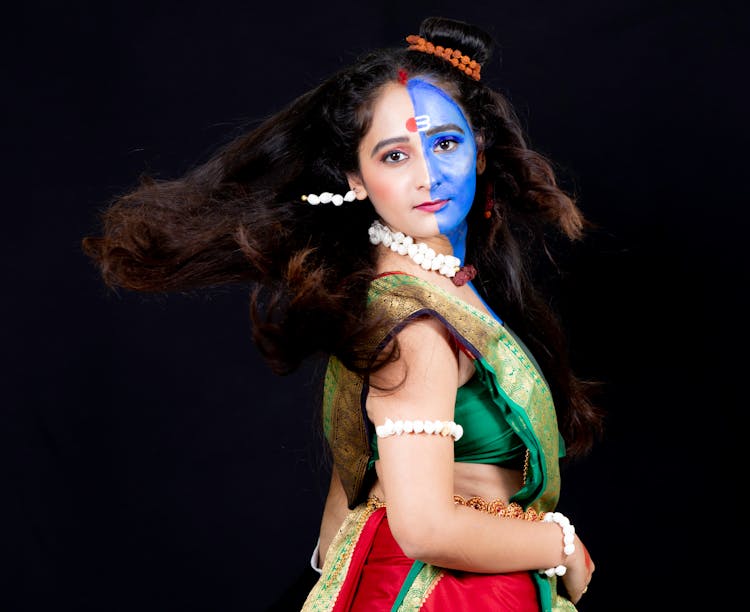 Woman In Green And Red Sari