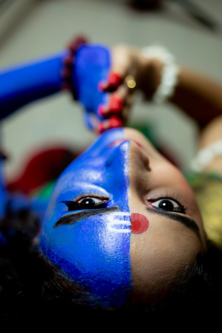 Woman With Blue And Red Face Paint