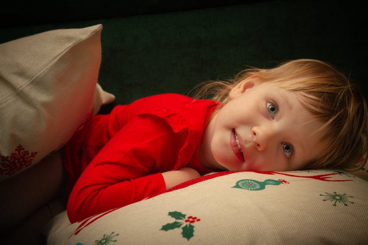 Girl Lying On A Throw Pillow