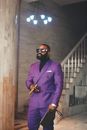 Man in Purple Suit Holding Cigar
