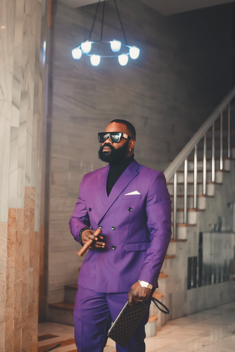 Man In Purple Suit Holding Cigar