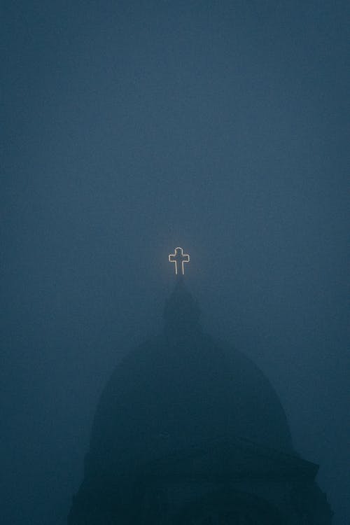 Church Rooftop with Glowing Cross