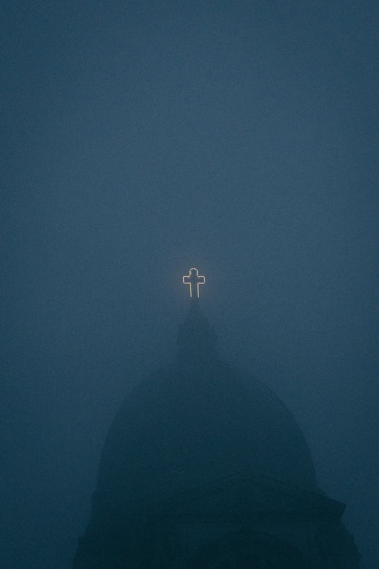 Church Rooftop With Glowing Cross