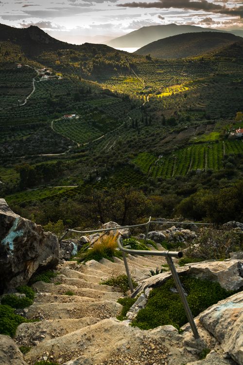 Free A breathtaking view of rugged Greek terrain with lush farmland and mountains. Stock Photo