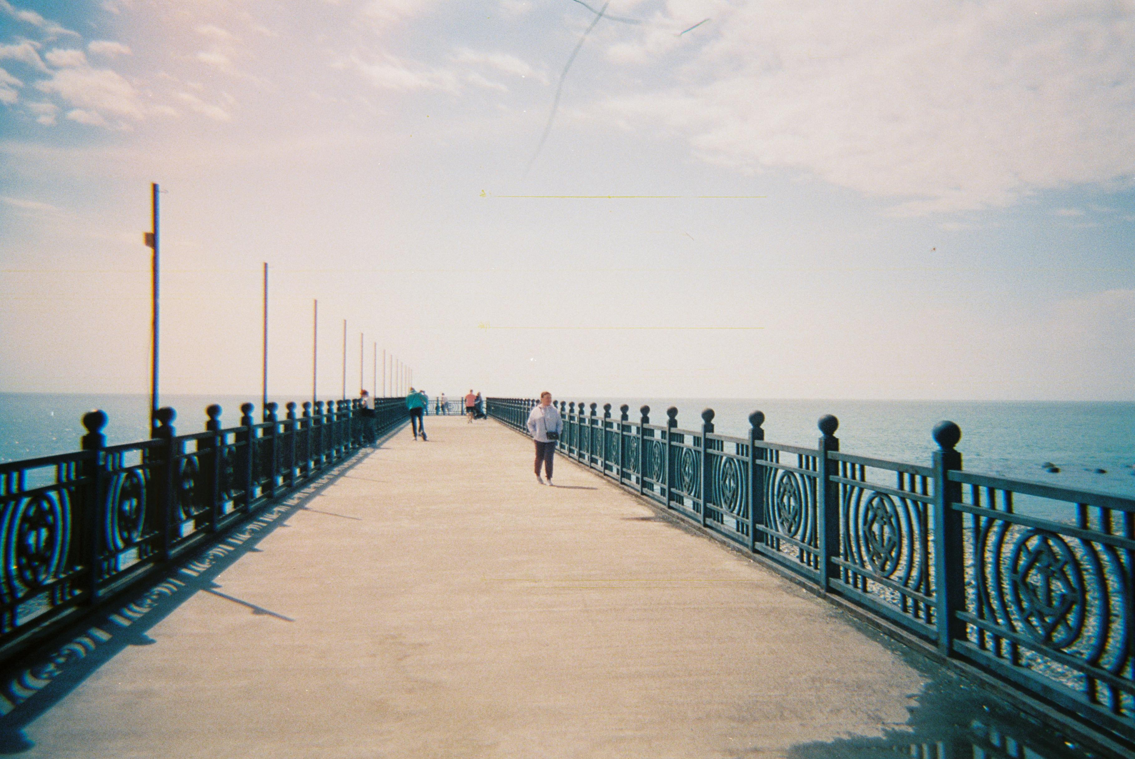 people walking on bridge