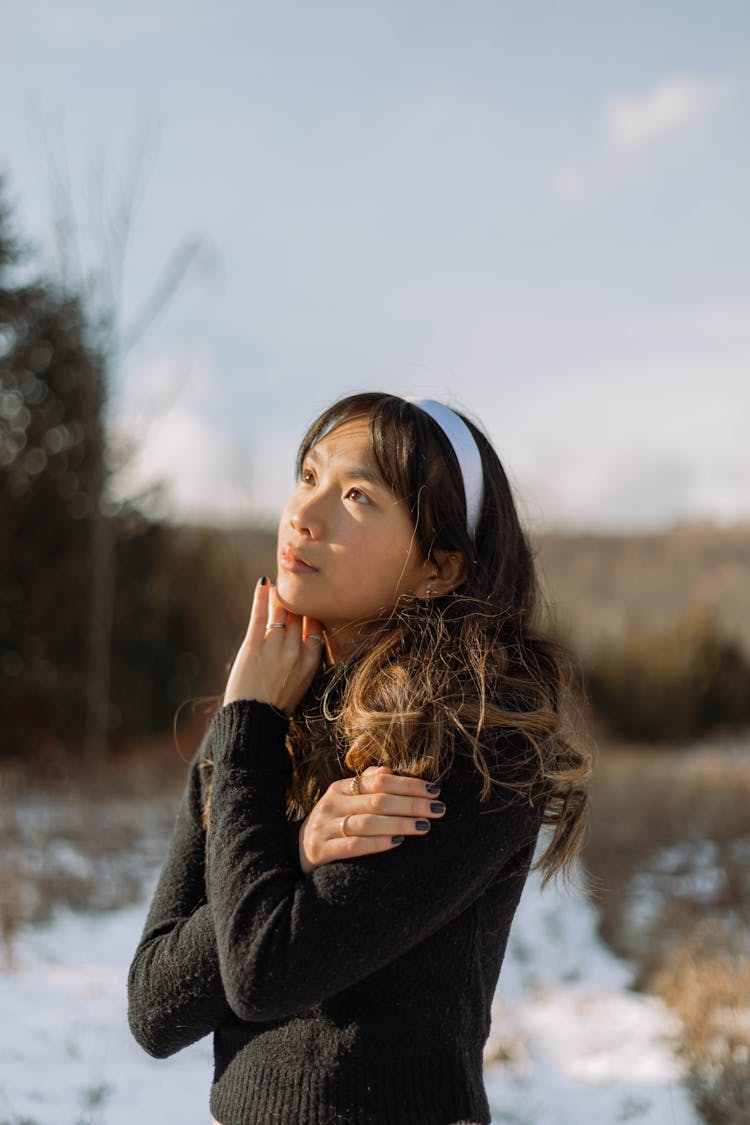 Portrait Of Woman In Black Sweater And Hairband