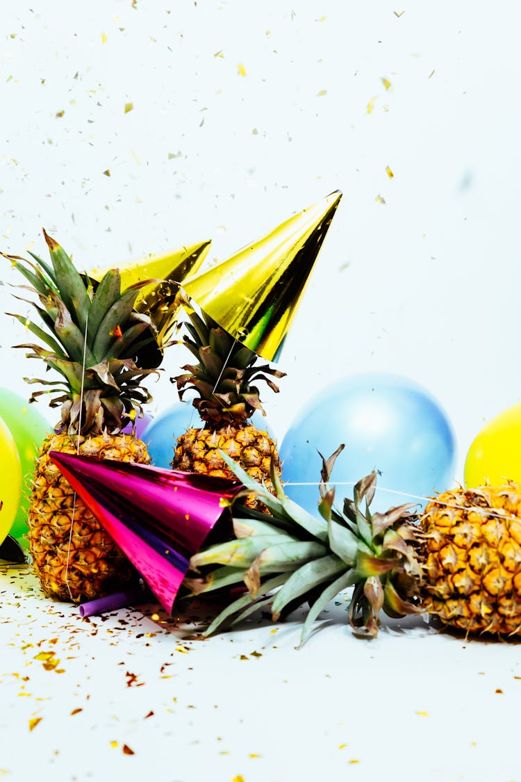 Three Pineapples With Gold Party Hats