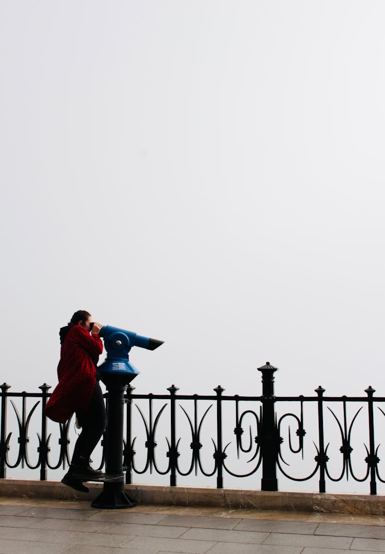 Woman Looking Through Binoculars