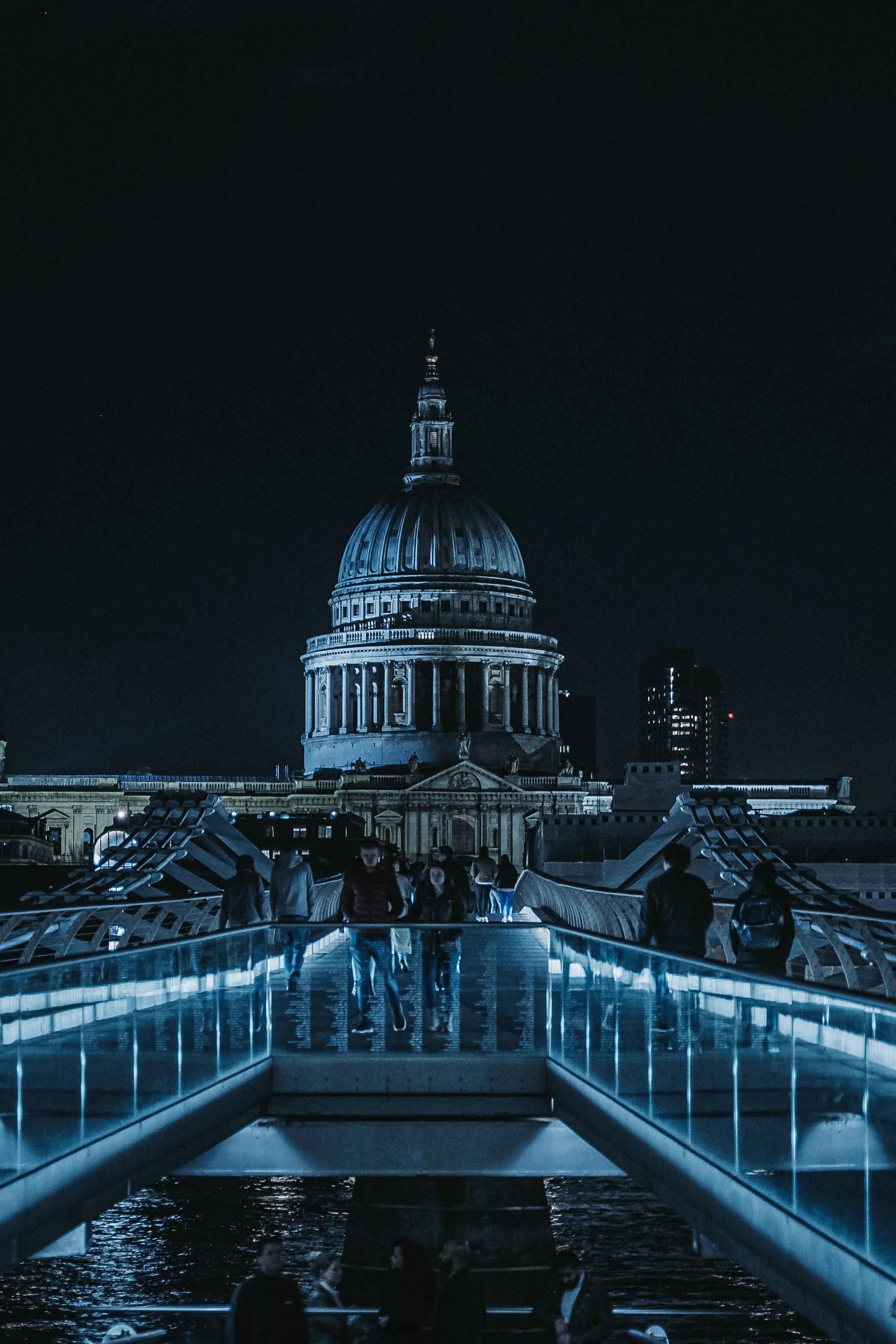 Stunning nighttime view of St Paul's Cathedral from Millennium Bridge in London.