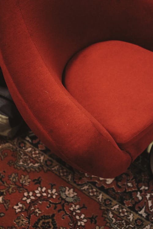Red Velvet Armchair on Carpet