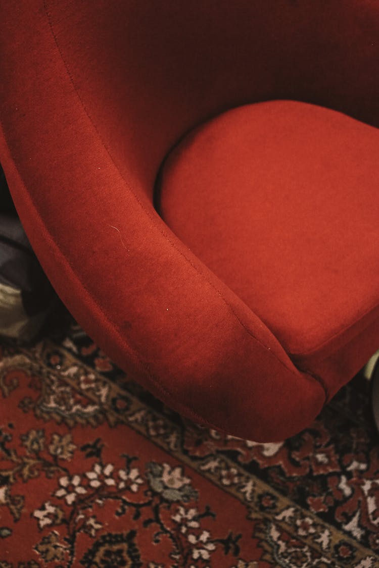 Red Velvet Armchair On Carpet