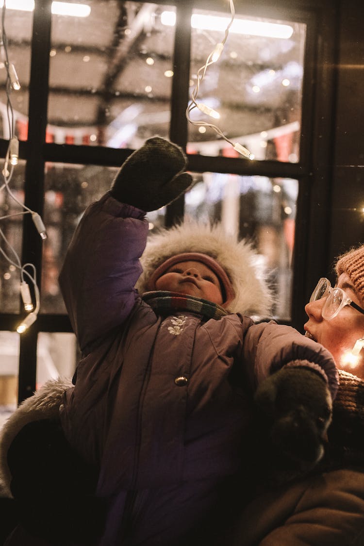 Mother Having Fun With Daughter In Winter