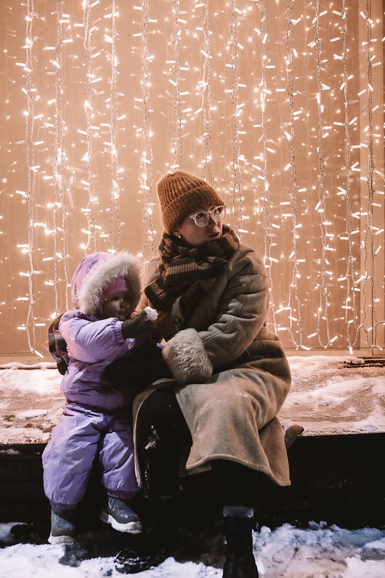 Mother Sitting With Daughter