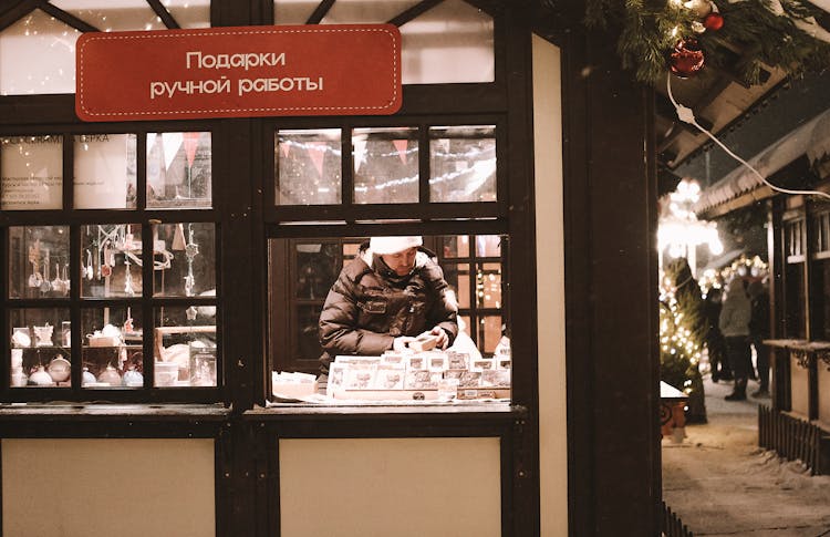 Man Selling Handmade Items At Christmas Fair