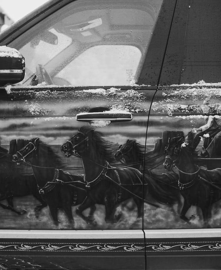 Grayscale Photo Of A The Horse Paint Job Of A Car