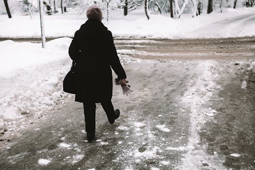 Back View of a Person Walking Wearing Trench Coat