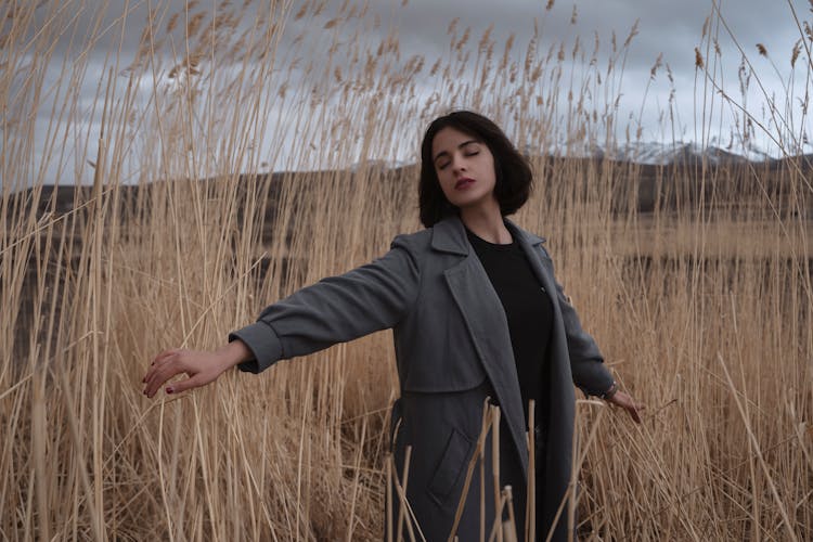 Woman Walking In Wheat Field