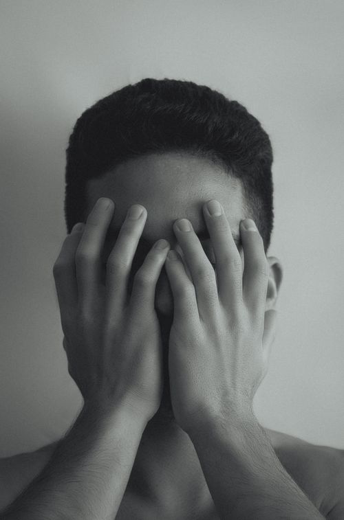 Man Holding His Face · Free Stock Photo