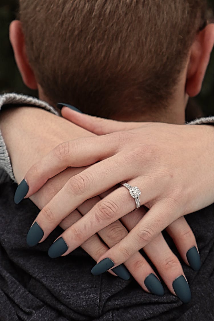 Person Wearing Silver Diamond Ring