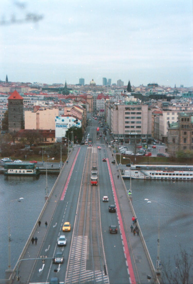 Aerial View Of Cars Passing By A Bridge