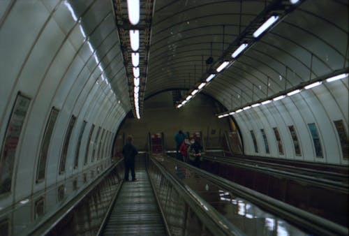 People on Escalators in Metro Station