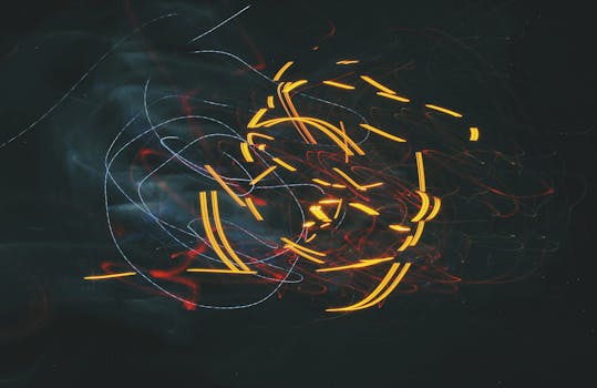 Captivating abstract image with dynamic light trails against a dark backdrop, showcasing vibrant colors and motion.