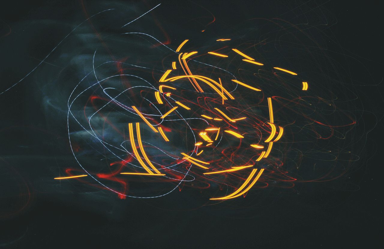 captivating abstract image with dynamic light trails against a dark ba