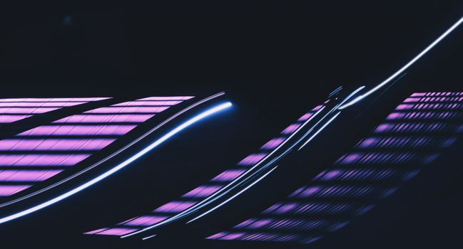 Vibrant abstract image of neon light trails against a dark background.