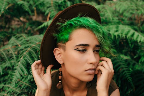 Woman with Dyed Hair among Plants