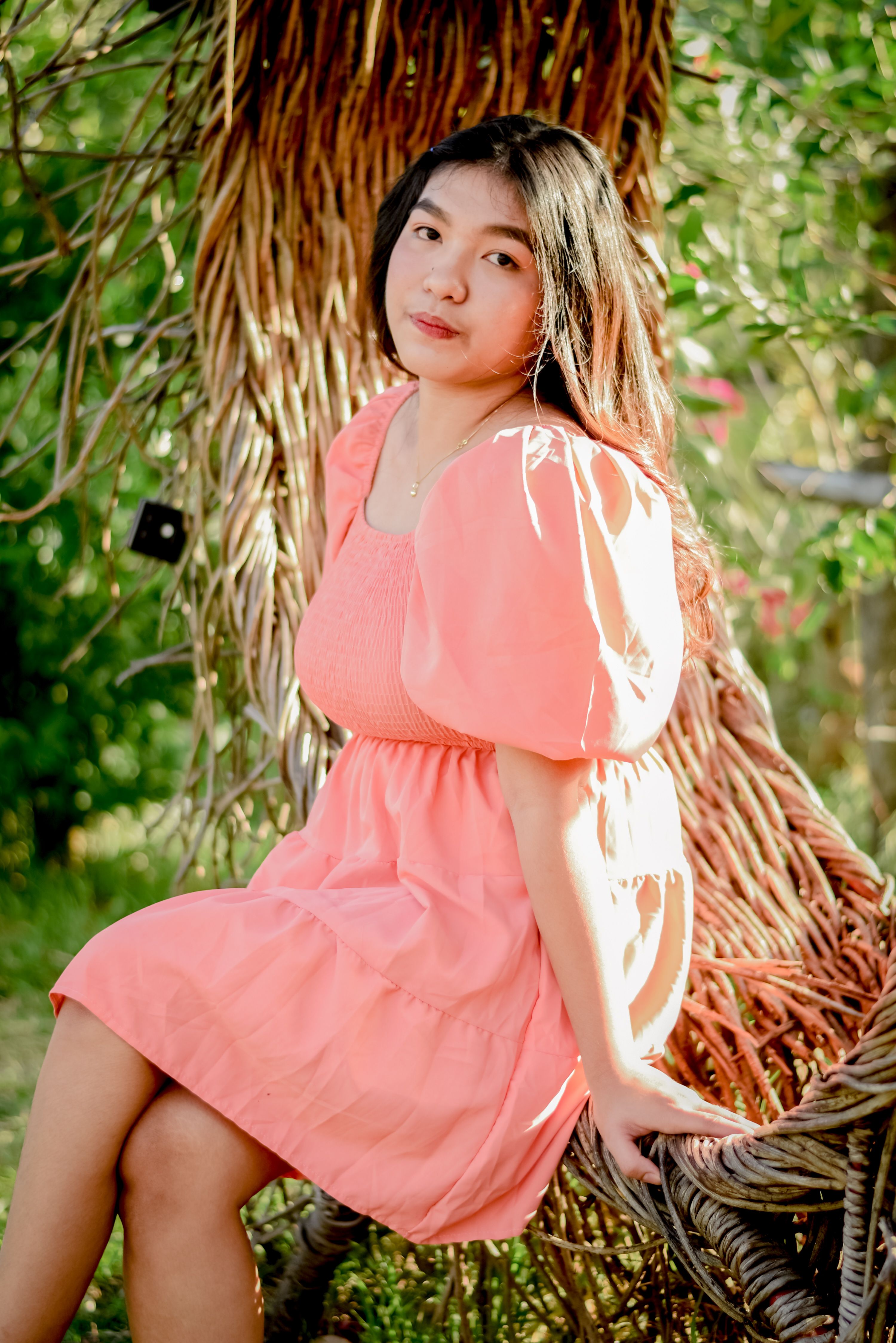 Pretty Woman in Pink Dress Sitting on a Bench · Free Stock Photo
