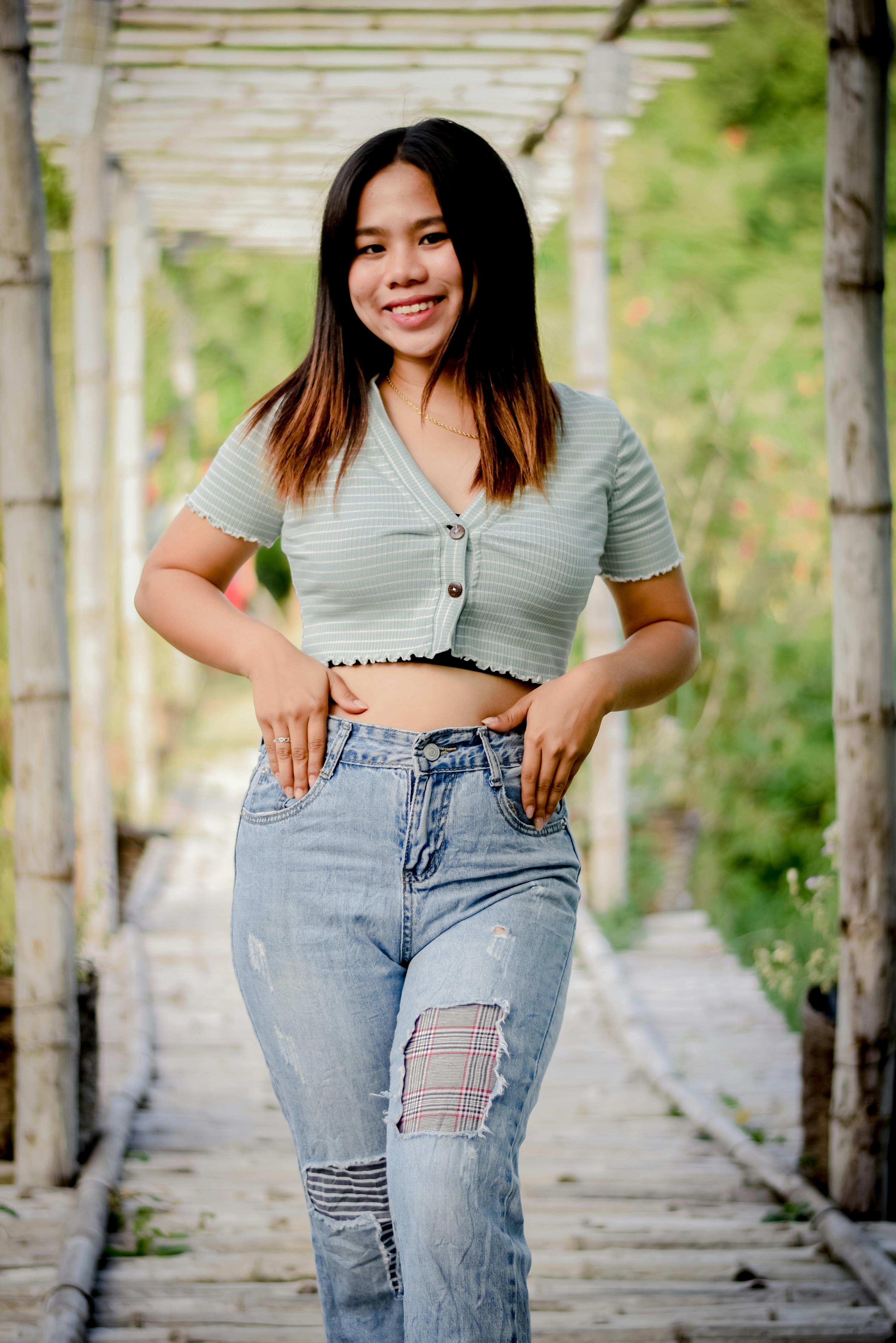 Portrait of Girl with Long Hair Wearing Crop Top and Jeans · Free Stock  Photo