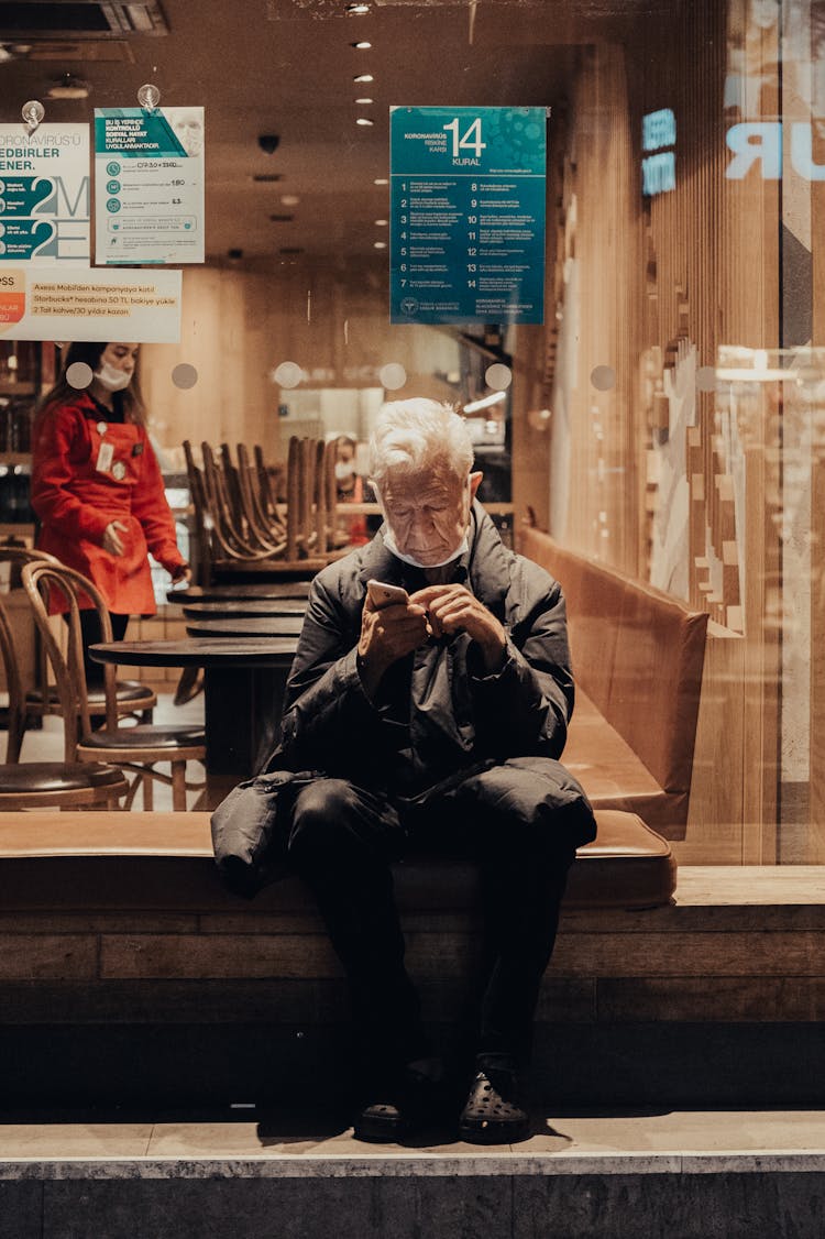 Man Sitting Outside The Coffee Shop