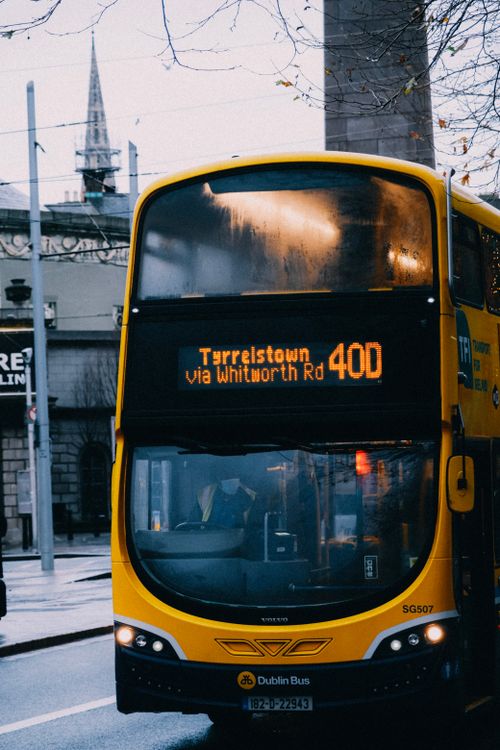 Free A double-decker bus in Dublin, Ireland, displaying route 40D signage on a rainy city street. Stock Photo