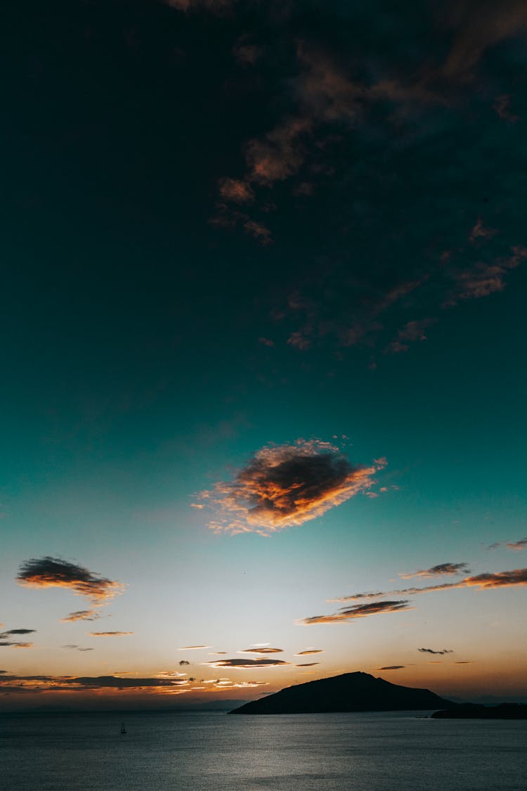 Silhouetted Island At Sunset 