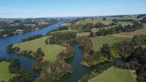 Free Explore the lush landscapes of Waikato River in Maungatautari, New Zealand from above. Stock Photo