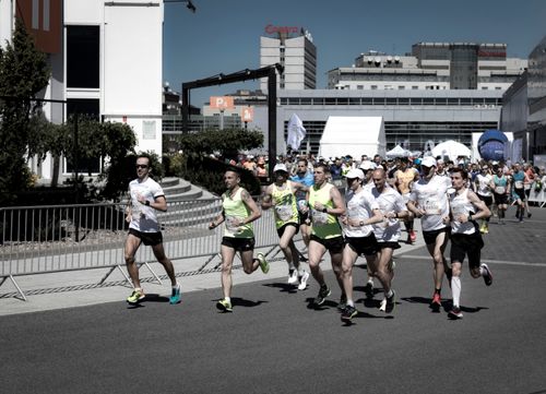 Free A group of diverse runners competing in an urban marathon on a sunny day. Stock Photo
