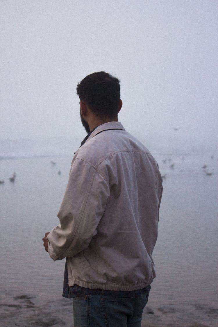 Back Of A Man Looking Over The Sea